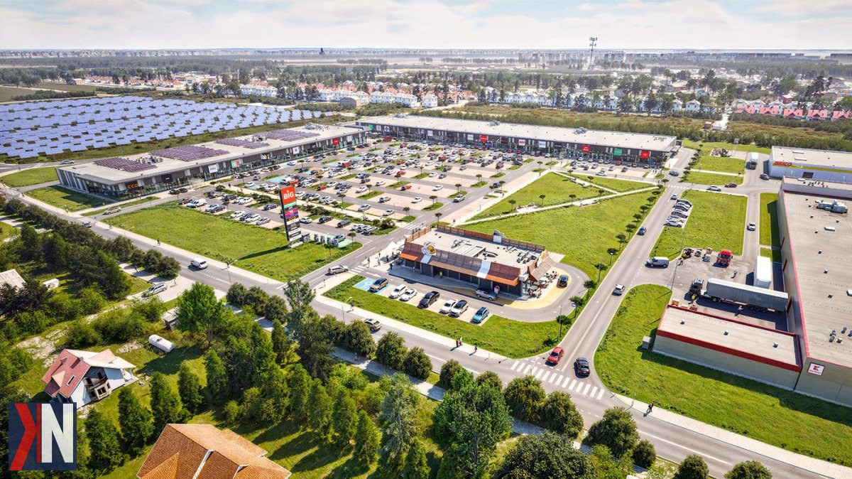 "Zdjęcie przedstawia wizualizację inwestycji BIG Konstantynów, nowego parku handlowego o powierzchni 21 tys. m², który powstaje na pograniczu Łodzi i Konstantynowa Łódzkiego. Projekt ten ma potencjał, aby zmienić zachodnią część aglomeracji i wpłynąć na lokalny rynek handlowy."